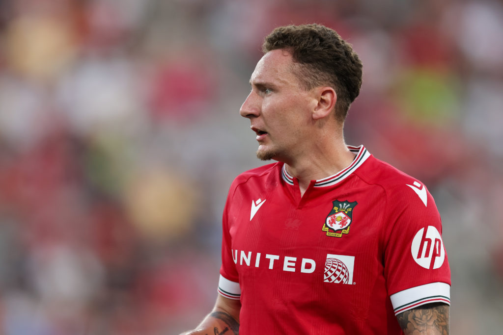 Callum McFadzean in action for Wrexham against Manchester United.