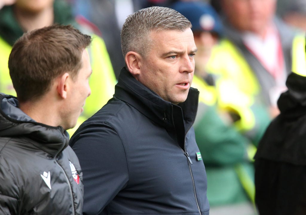 Bolton Wanderers boss Steven Schumacher looks on against Stockport County.