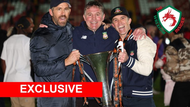 Wrexham manager Phil Parkinson celebrates with owners Ryan Reynolds and Rob McElhenney after winning National League promotion.