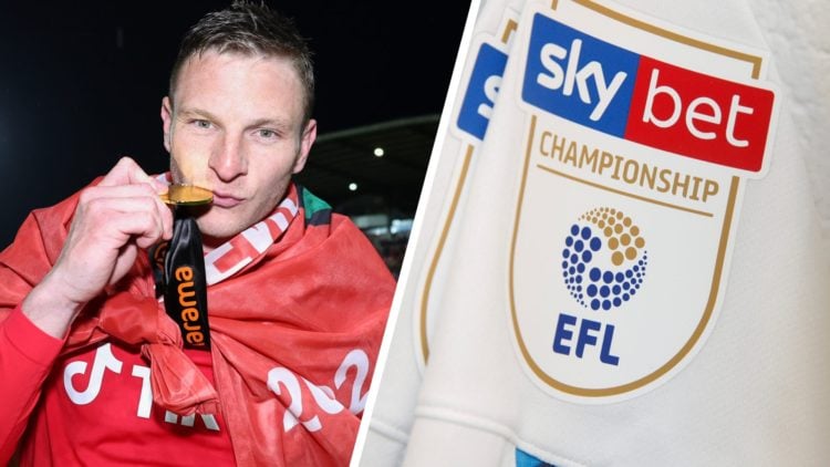 Paul Mullin of Wrexham kisses his champions winner medal as Wrexham celebrate promotion back to the English Football League. The Sky Bet logo is sh...