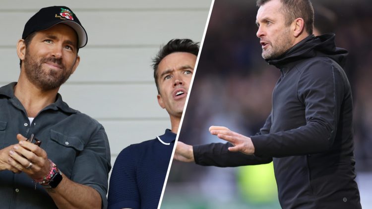Ryan Reynolds, Owner of Wrexham and Rob McElhenney, Actor and Co-Owner of Wrexham react prior to the Vanarama National League Play-Off Semi Final m...