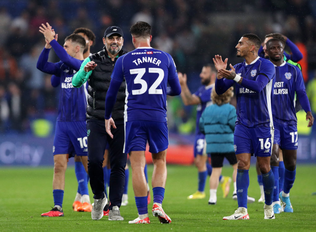 Cardiff City player Ollie Tanner embraces manager Erol Bulut.
