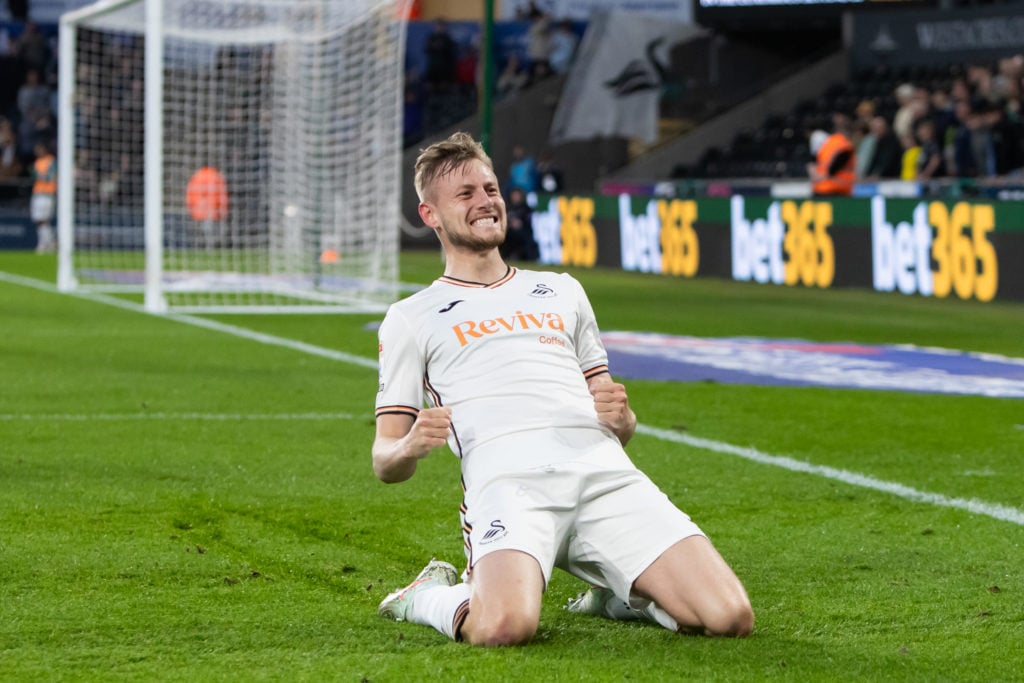 Swansea City defender Harry Darling celebrates scoring against Plymouth Argyle.