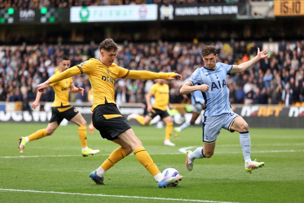 Ben Davies challenges Jorgen Strand Larsen during Wolverhampton Wanderers FC v Tottenham Hotspur FC in the Premier League clash.