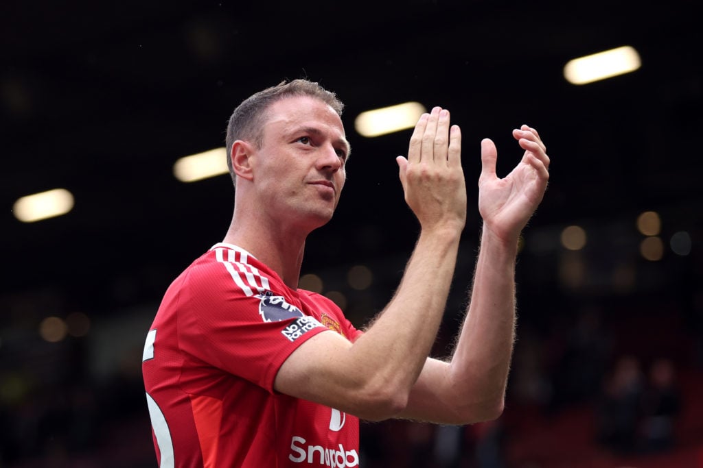 Manchester United player Jonny Evans applauds the fans after a Premier League match against Aston Villa.