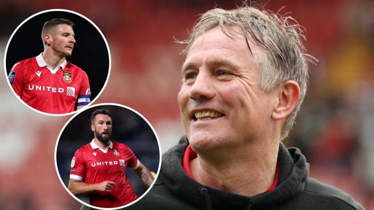 Image of: Phil Parkinson, Manager of Wrexham, celebrates victory and promotion into League One following the Sky Bet League Two match between Wrexh...