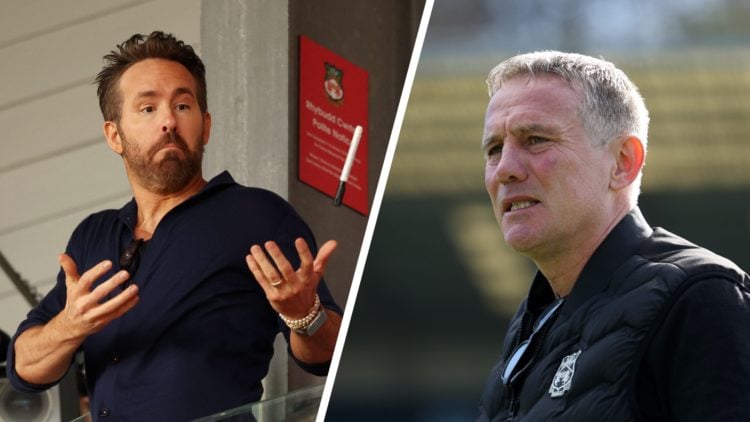 Wrexham co-owner Ryan Reynolds in the stands at the Racecourse Ground. Manager Phil Parkinson looks on.