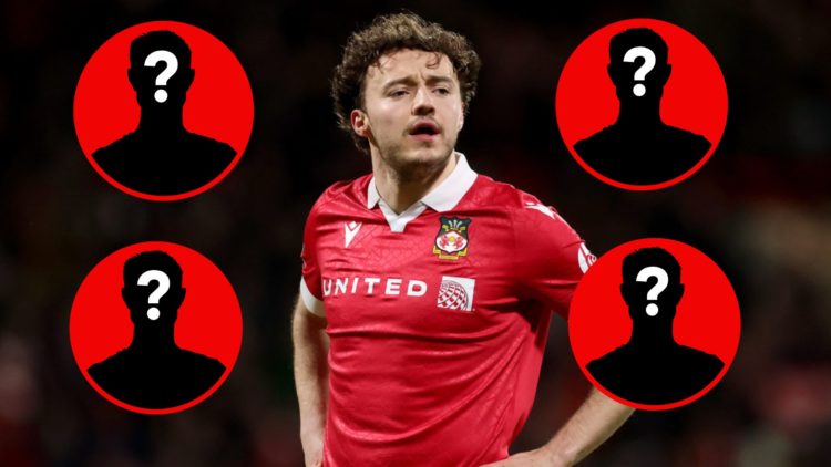 Wrexham midfielder Ollie Rathbone looks on during a game.