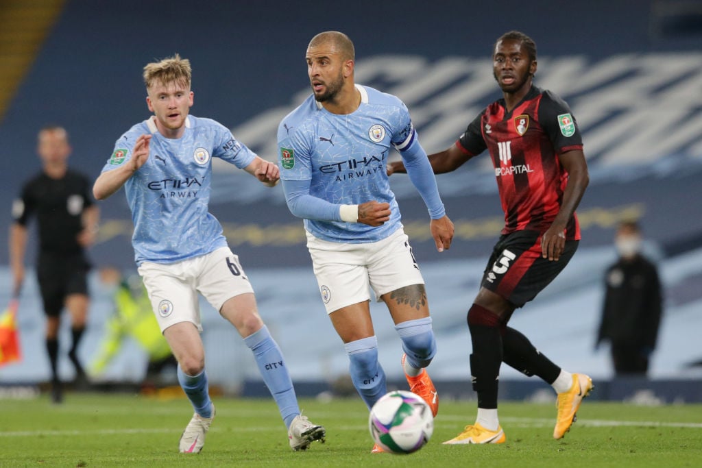 Manchester City's Kyle Walker and Tommy Doyle in action against AFC Bournemouth.