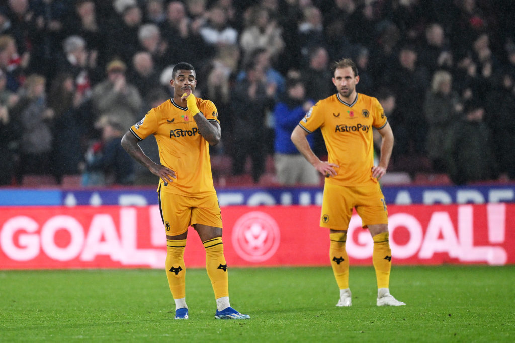 Craig Dawson and Mario Lemina in action during Sheffield United v Wolverhampton Wanderers in the Premier League clash.
