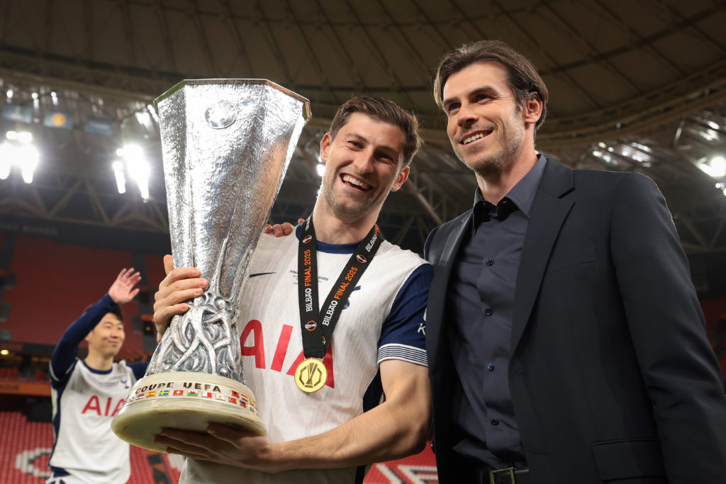 Tottenham Hotspur's Ben Davies celebrates winning the Europa League trophy alongside Gareth Bale.