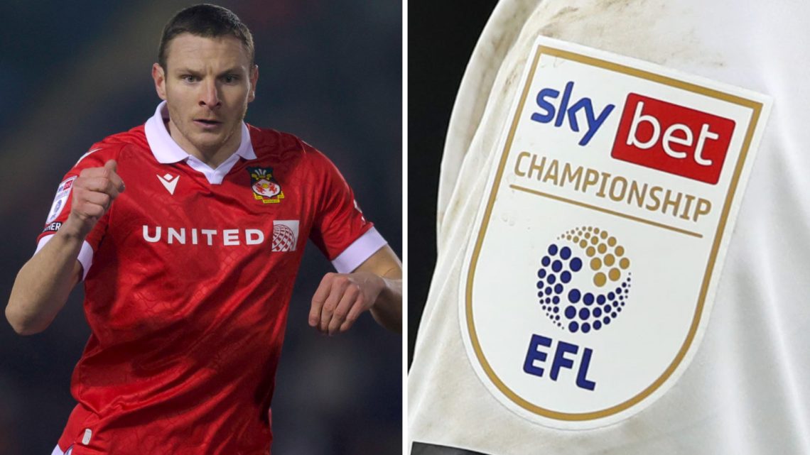 Paul Mullin of Wrexham looks on during the Sky Bet League One match between Shrewsbury Town FC and Wrexham AFC. A detailed view of a shirt sleeve w...
