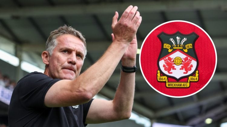 Phil Parkinson applauds the fans during the Sky Bet League One match between Bolton Wanderers FC and Wrexham AFC. The official club badge of Wrexha...
