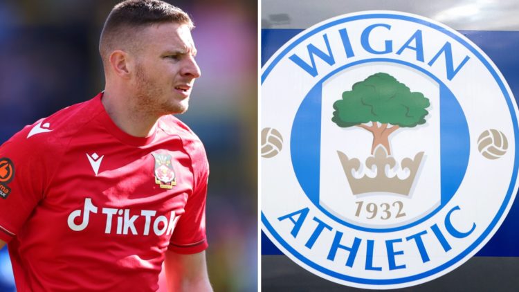 Paul Mullin of Wrexham during the Vanarama National League fixture between FC Halifax Town and Wrexham AFC. The club crest of Wigan Athletic is see...