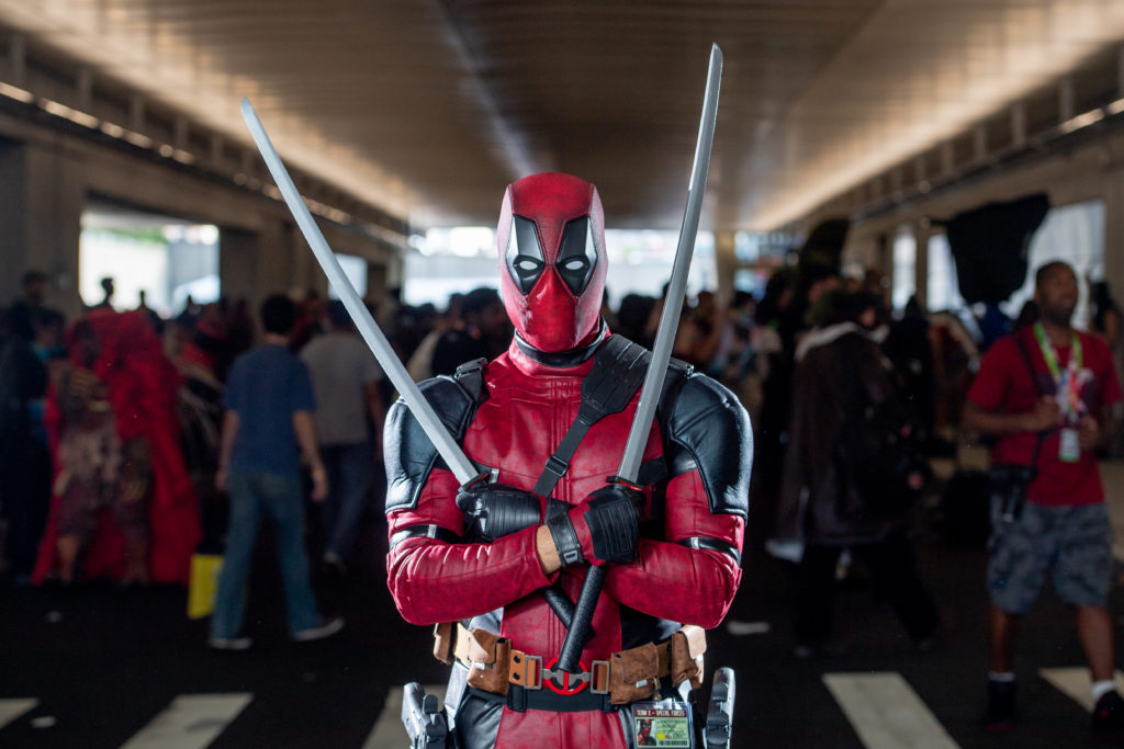 A fan cosplays as Deadpool from the Marvel Universe during the 2018 New York Comic-Con.