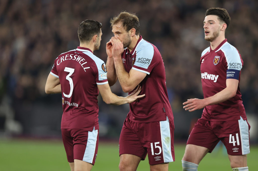 Craig Dawson speaks to Aaron Cresswell during West Ham United's game against Sevilla.