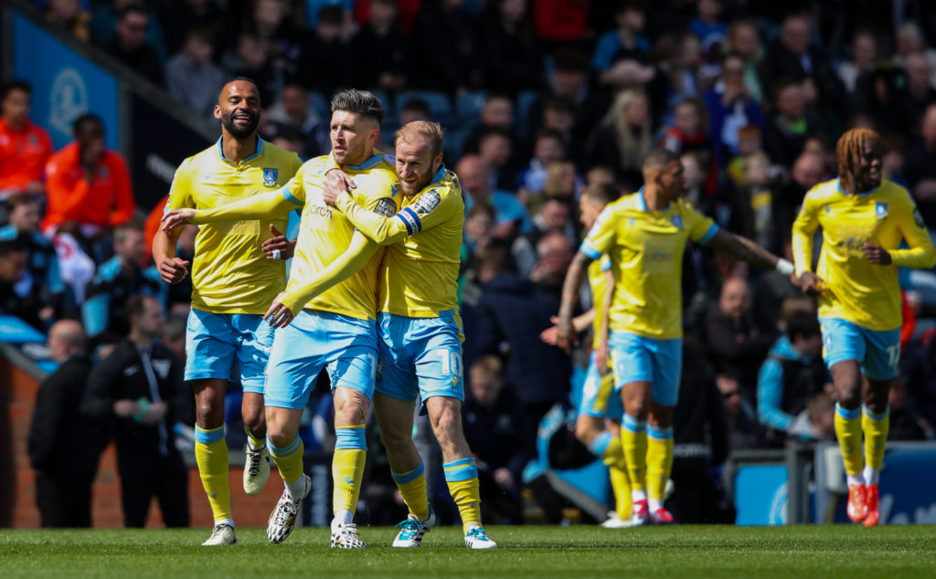 Sheffield Wednesday's Josh Windass celebrates scoring the opening goal with Barry Bannan