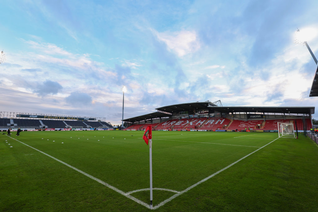 A general interior view of the 'Fourth Wall' temporary Kop stand and main stand at STK Cae Ras / Racecourse Ground