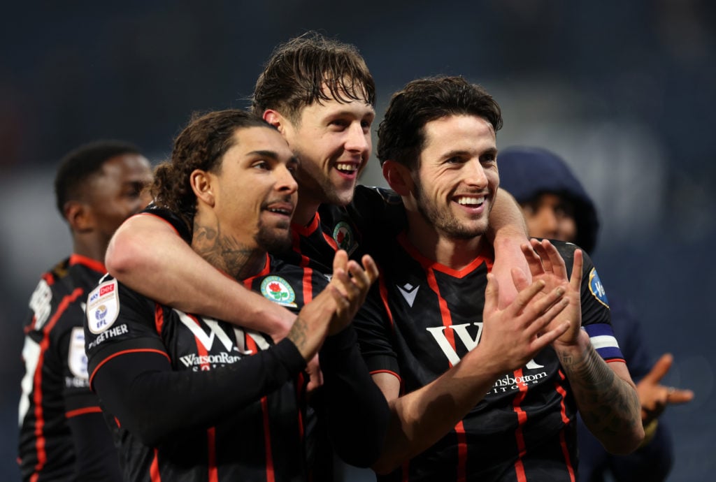 Tyrhys Dolan, Callum Brittain and Lewis Travis celebrate for Blackburn Rovers.
