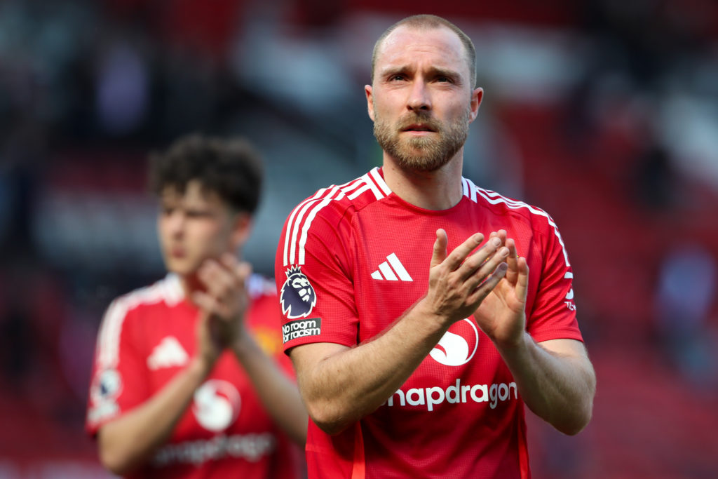 Manchester United player Christian Eriksen applauds the fans.