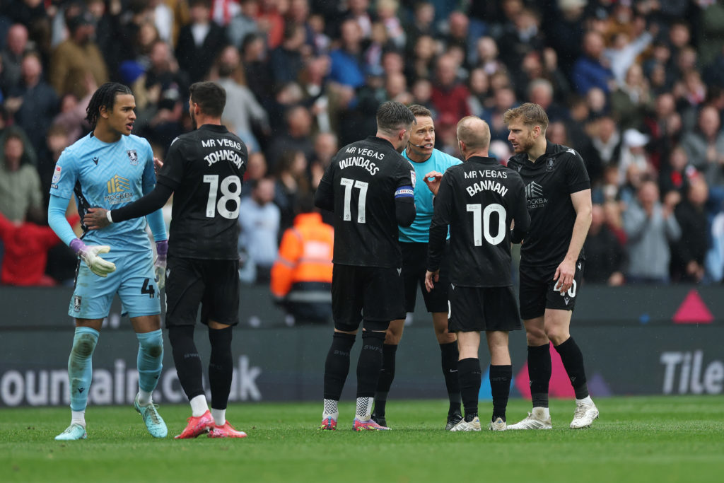 Sheffield Wednesday's Barry Bannan and Stuart Armstrong speak to referee Stephen Martin.