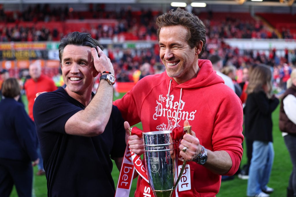Rob McElhenney and Ryan Reynolds co-owners of Wrexham with the promotion trophy during the Sky Bet League One match between Wrexham AFC and Charlton Athletic