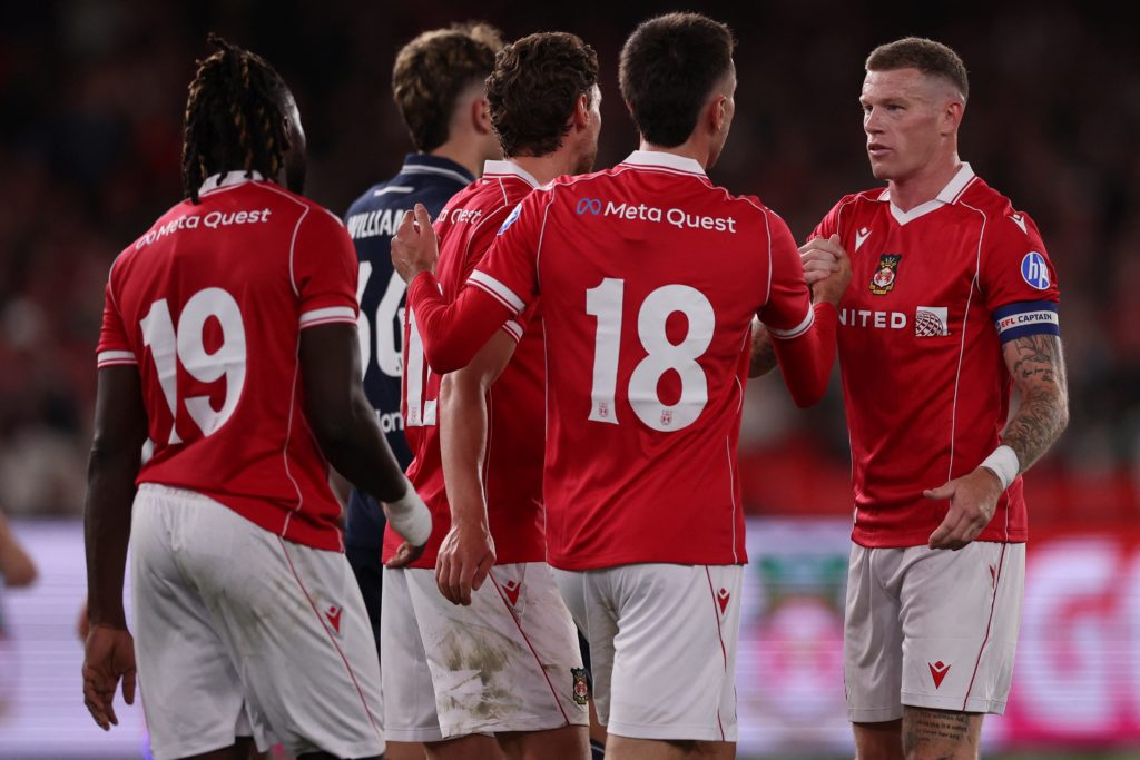 Wrexham players celebrate a goal in the win over Melbourne Victory.