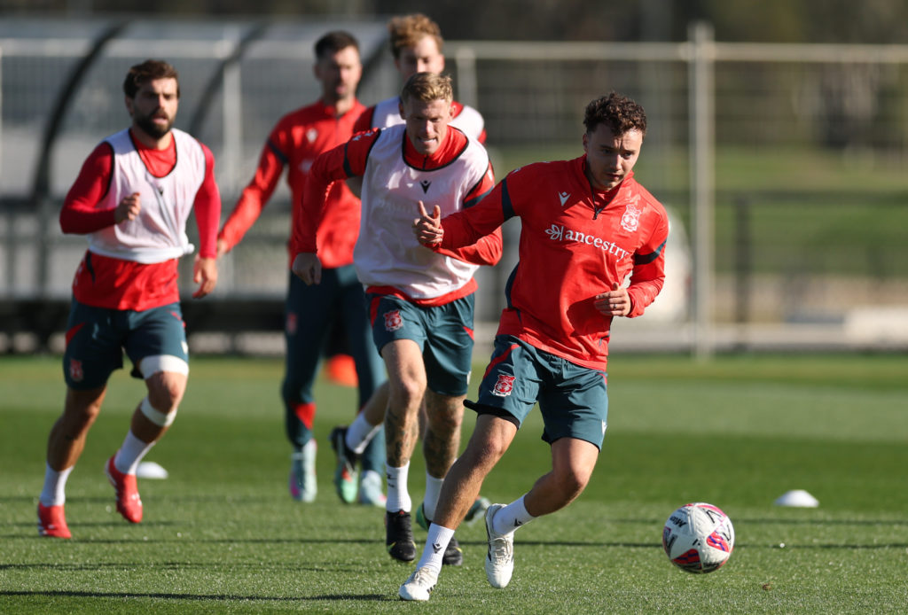 Ollie Rathbone and James McClean in action during Wrexham AFC Media Opportunity And Training Session.