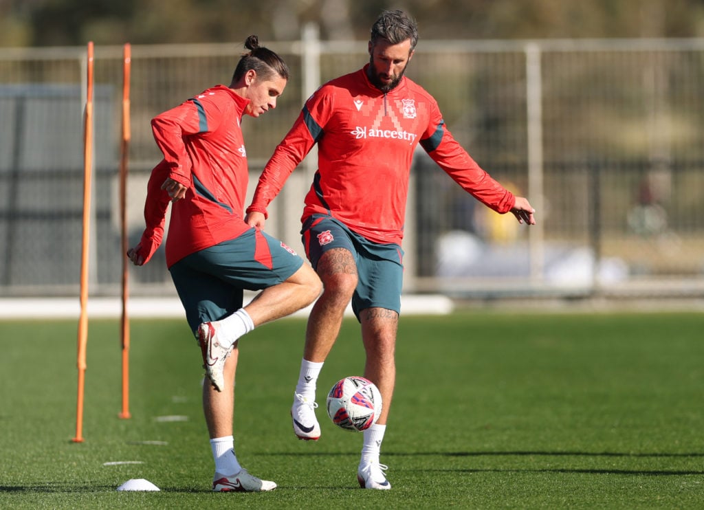 Wrexham's George Dobson and Ollie Palmer in training.