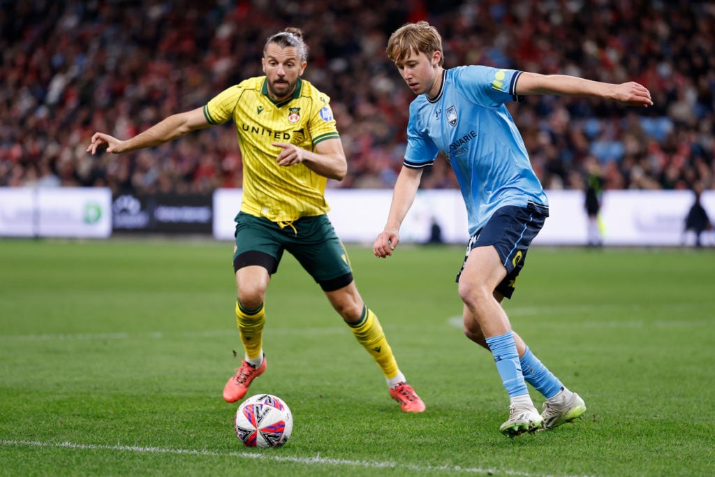 Jared Middleton of Sydney FC battles for possession with Jay Rodriguez of Wrexham AFC