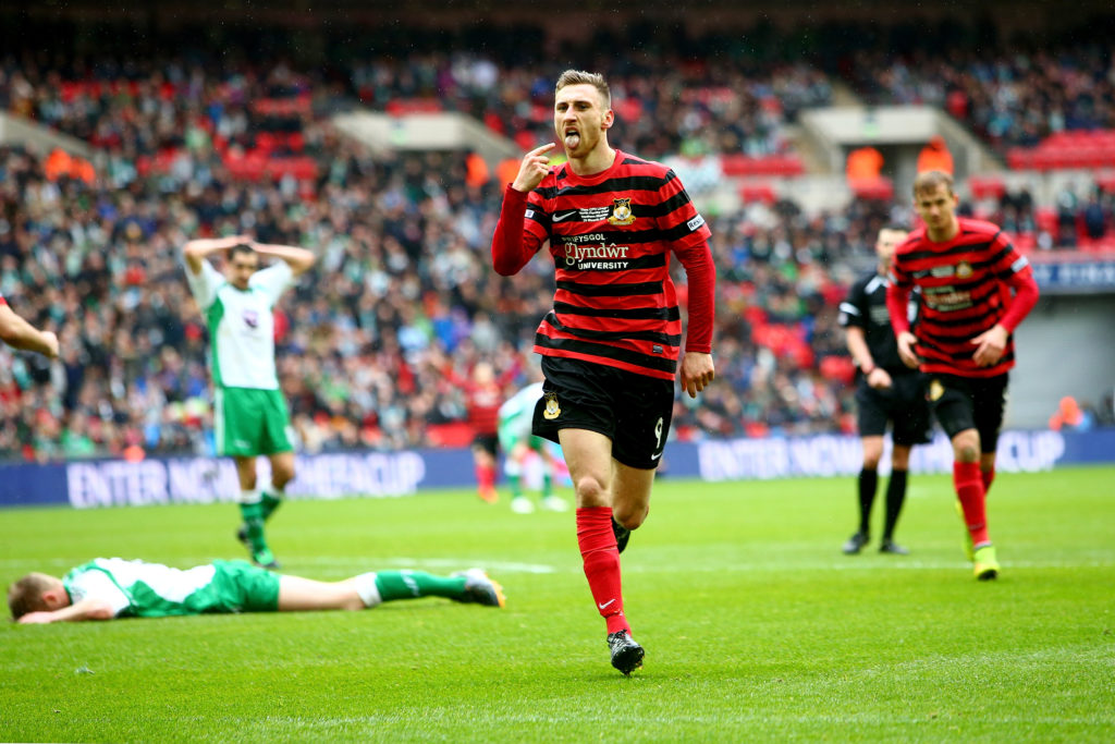 Louis Moult of Wrexham celebrates after scoring.
