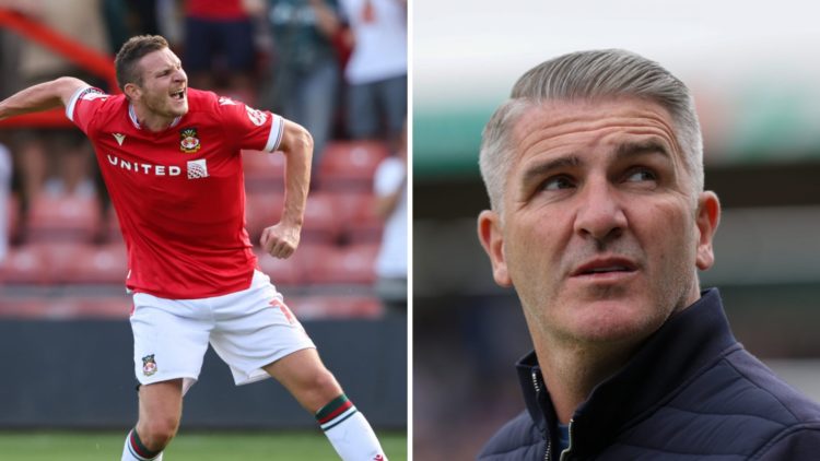 Paul Mullin of Wrexham celebrates victory during the Sky Bet League Two match between Wrexham and Doncaster Rovers. Wigan Athletic's manager Ryan Lowe