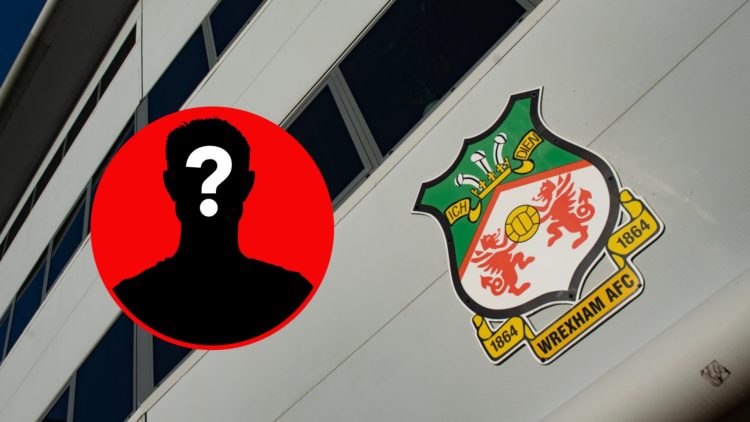 The official club badge of Wrexham AFC displayed on the outside of the Racecourse Ground