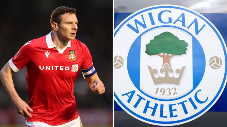 Paul Mullin looks on during the Emirates FA Cup First Round match between Harrogate Town and Wrexham. The club crest of Wigan Athletic is seen outs...