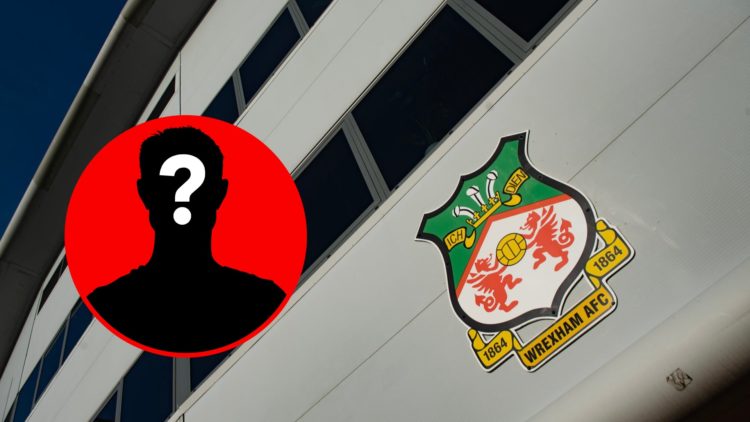 The official club badge of Wrexham AFC displayed on the outside of the Racecourse Ground
