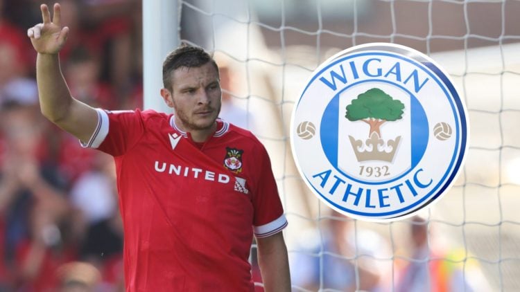 Paul Mullin during the Sky Bet League Two match between Wrexham and Doncaster Rovers. The club crest of Wigan Athletic is seen outside DW Stadium p...