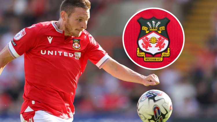 Paul Mullin of Wrexham during the Sky Bet League Two match between Wrexham and Doncaster Rovers. The official club badge of Wrexham AFC on a home s...