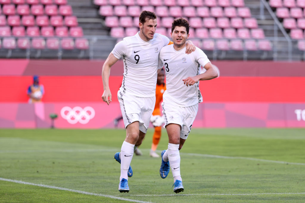 Chris Wood celebrates alongside Liberato Cacace for New Zealand.