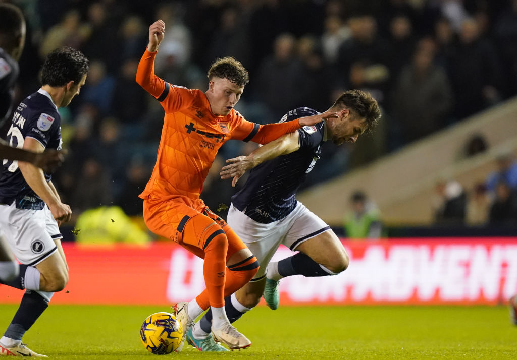 Nathan Broadhead of Ipswich Town and Ryan Leonard of Millwall battle for the ball