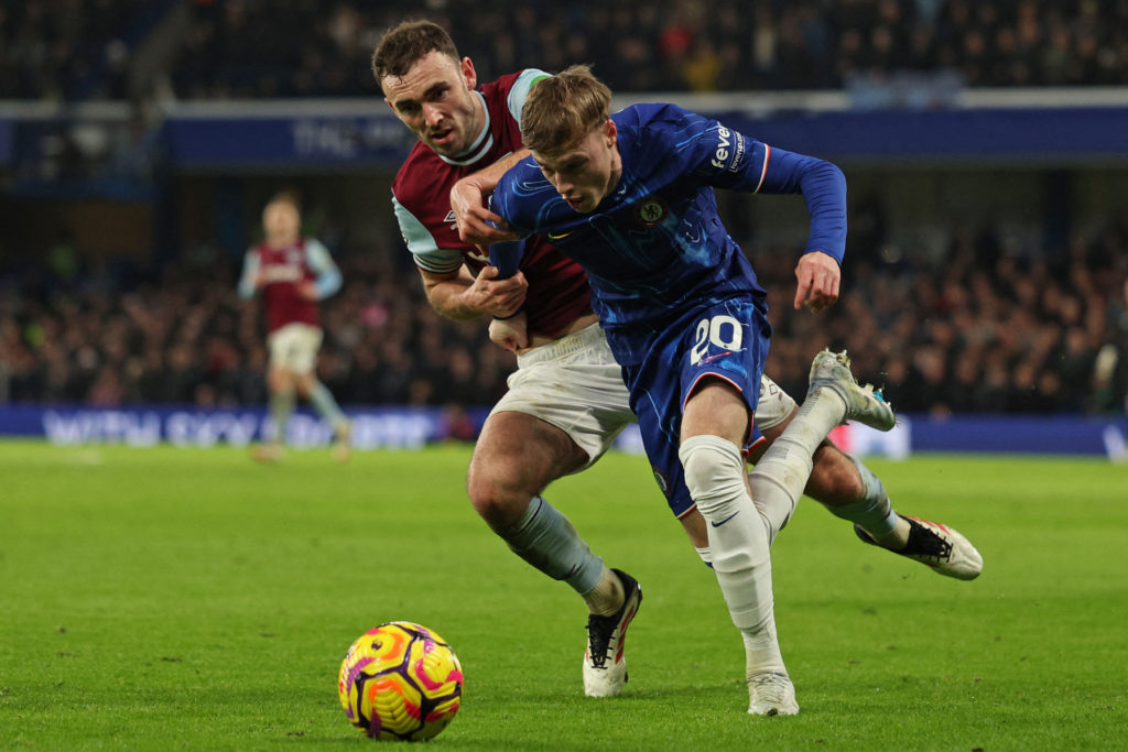 Chelsea's English midfielder #20 Cole Palmer (R) is fouled by West Ham United's Scottish midfielder #39 Andy Irving (L)