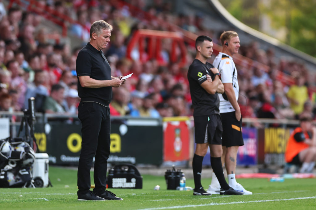 Phil Parkinson the head coach / manager of Wrexham takes notes