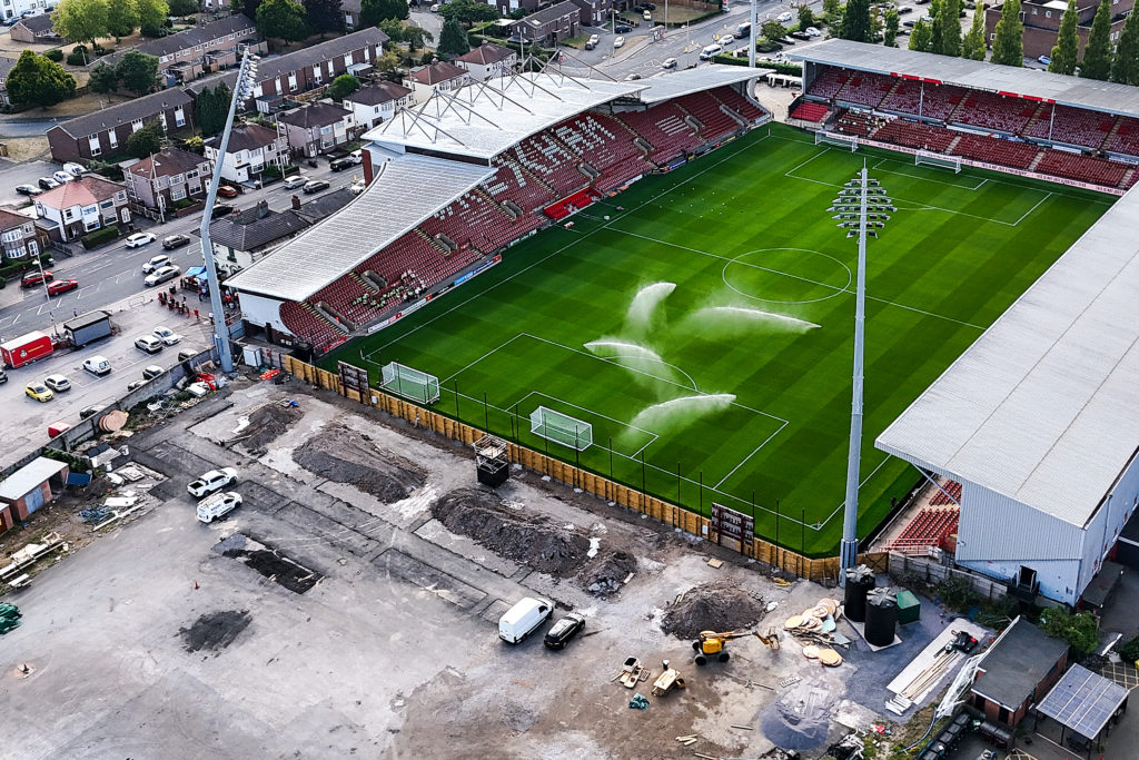 A general aerial view of Racecourse Ground, home stadium of Wrexham as work on The Kop stand expansion is seen in progress