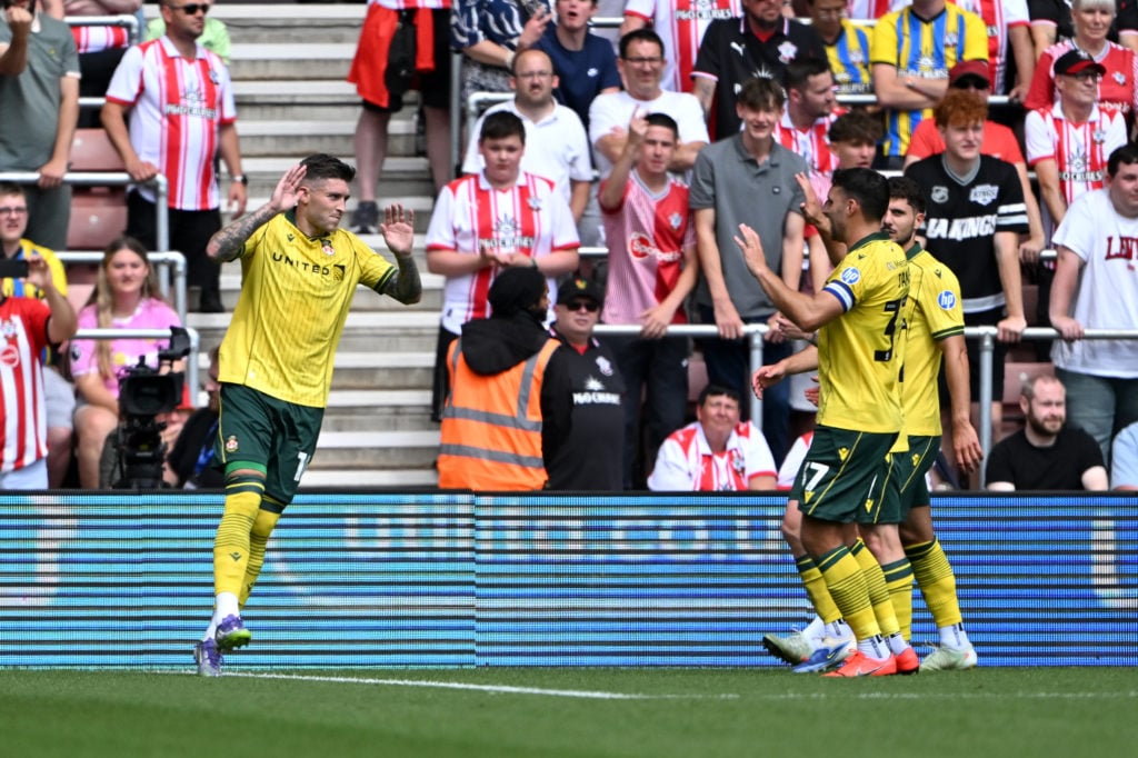 Josh Windass of Wrexham celebrates.