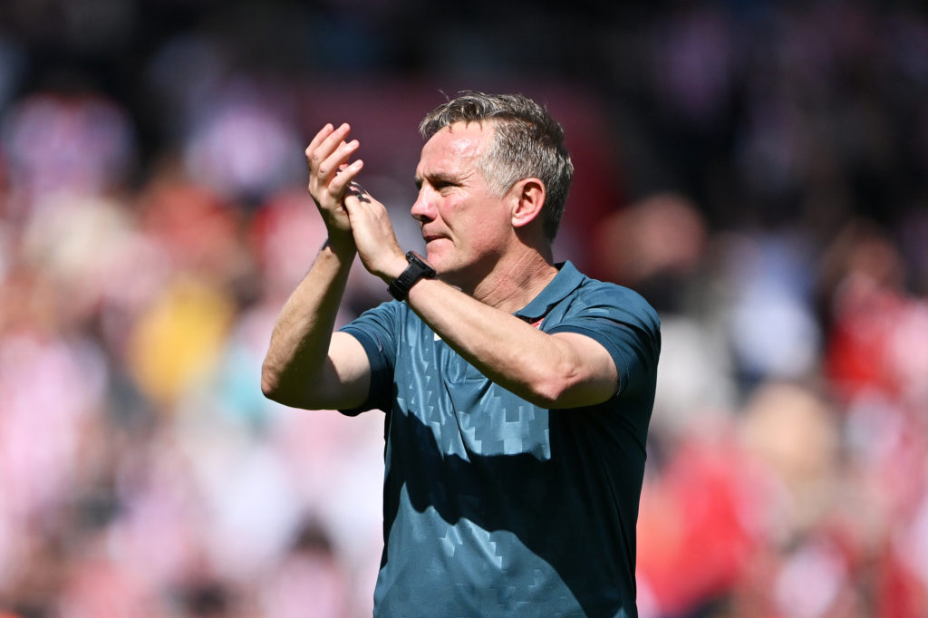 Phil Parkinson, Manager of Wrexham applauds the fans