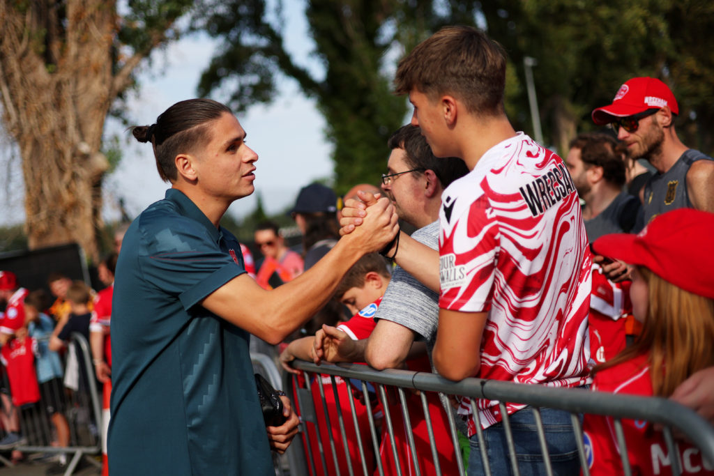 George Dobson of Wrexham greets fans