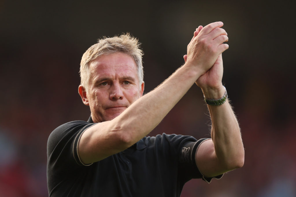 Phil Parkinson, Manager of Wrexham, applauds the fans