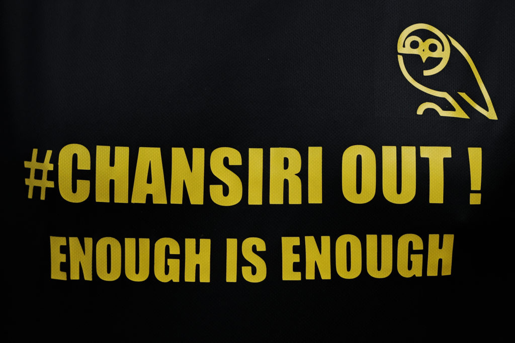 A detailed view of a Sheffield Wednesday supporter's shirt is seen with a message aimed at Sheffield Wednesday director Dejphon Chansiri during the Carabao Cup First Round match between Bolton Wanderers and Sheffield Wednesday.