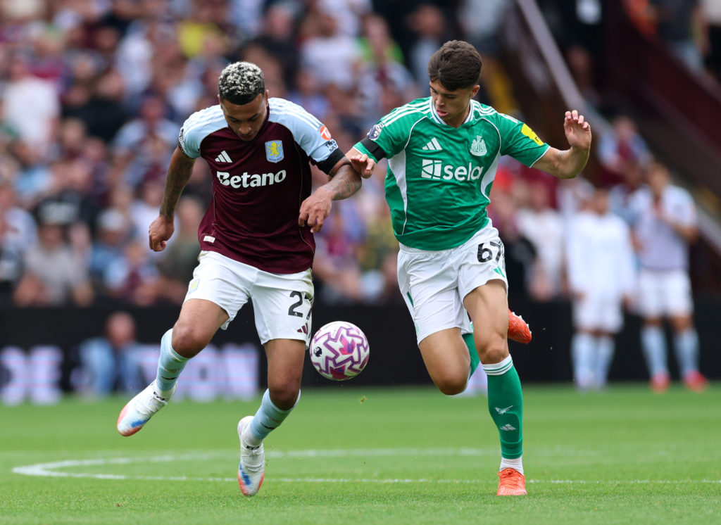 Morgan Rogers of Aston Villa battles for possession with Lewis Miley of Newcastle United