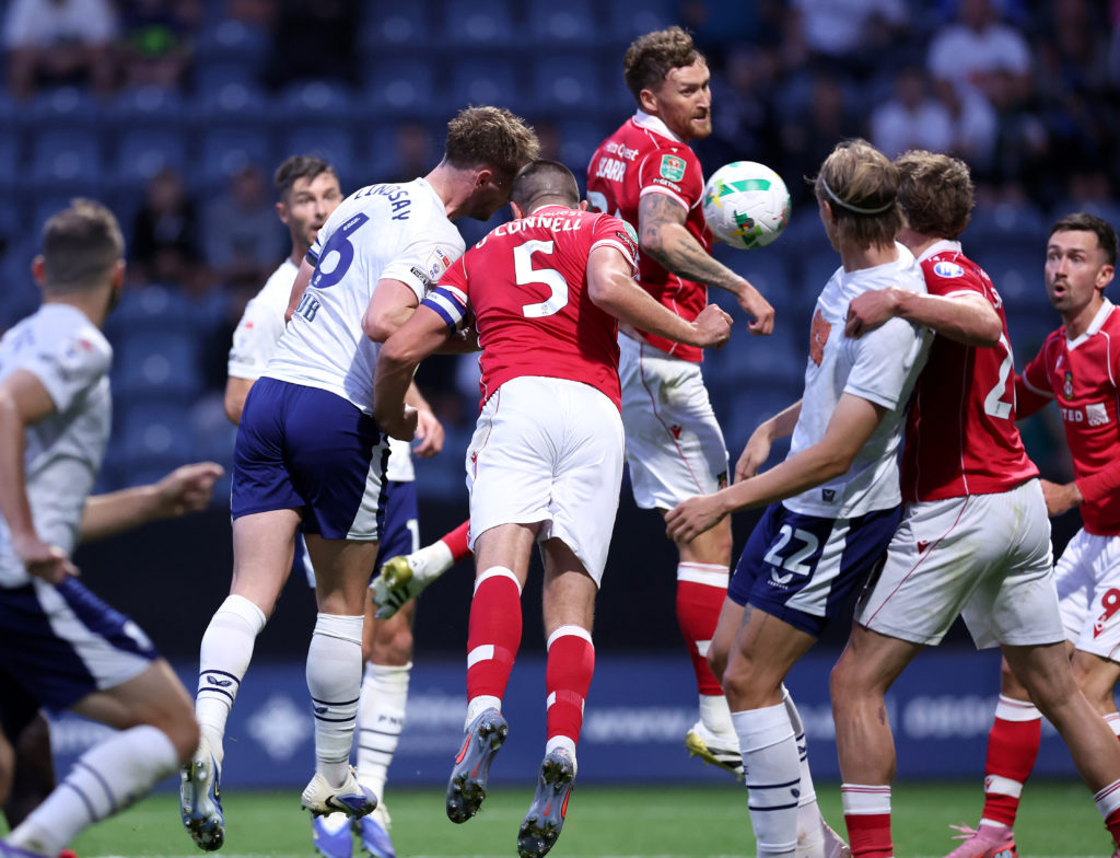 Eoghan O'Connell challenges for the ball during Preston North End v Wrexham in the Carabao Cup Second Round clash.