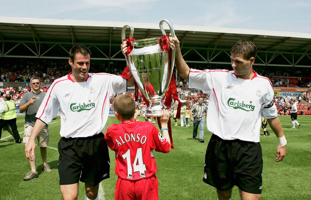 Liverpool captain Steven Gerrard and Jamie Carragher parade the European Cup